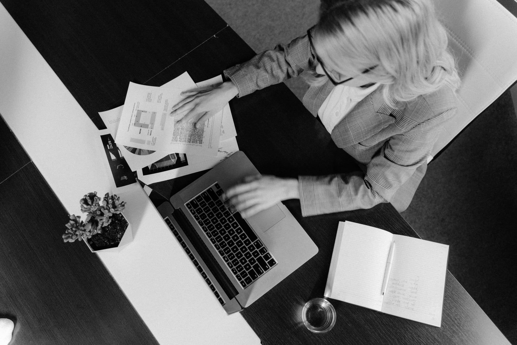 Overhead shot of a woman working at her desk